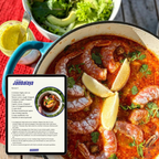 Jambalaya dish with shrimp and herbs, served in a blue pot on a red tablecloth. Benson Detox recipe